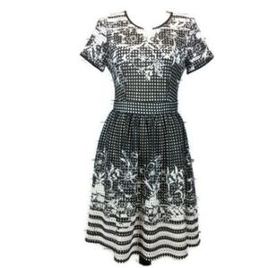 Gabby Skye black white laser cut fit & flare dress